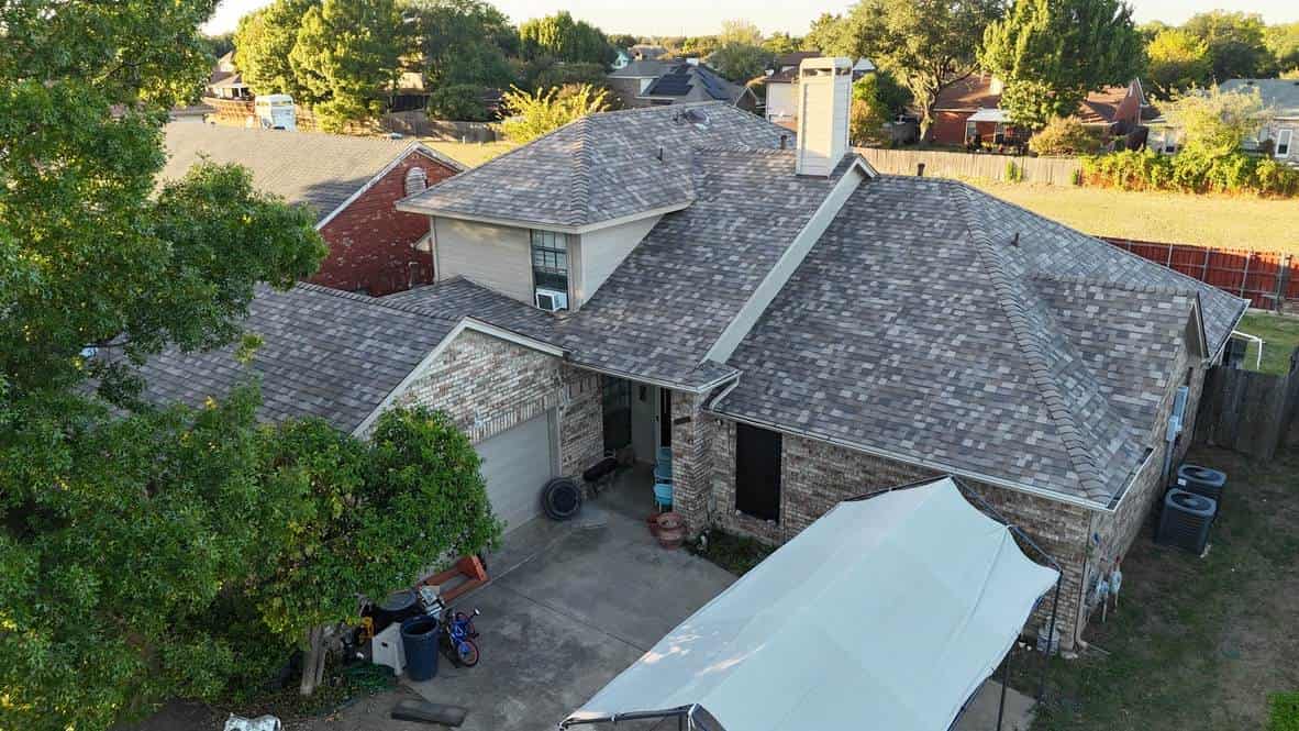 Brick home with a newly installed shingle roof