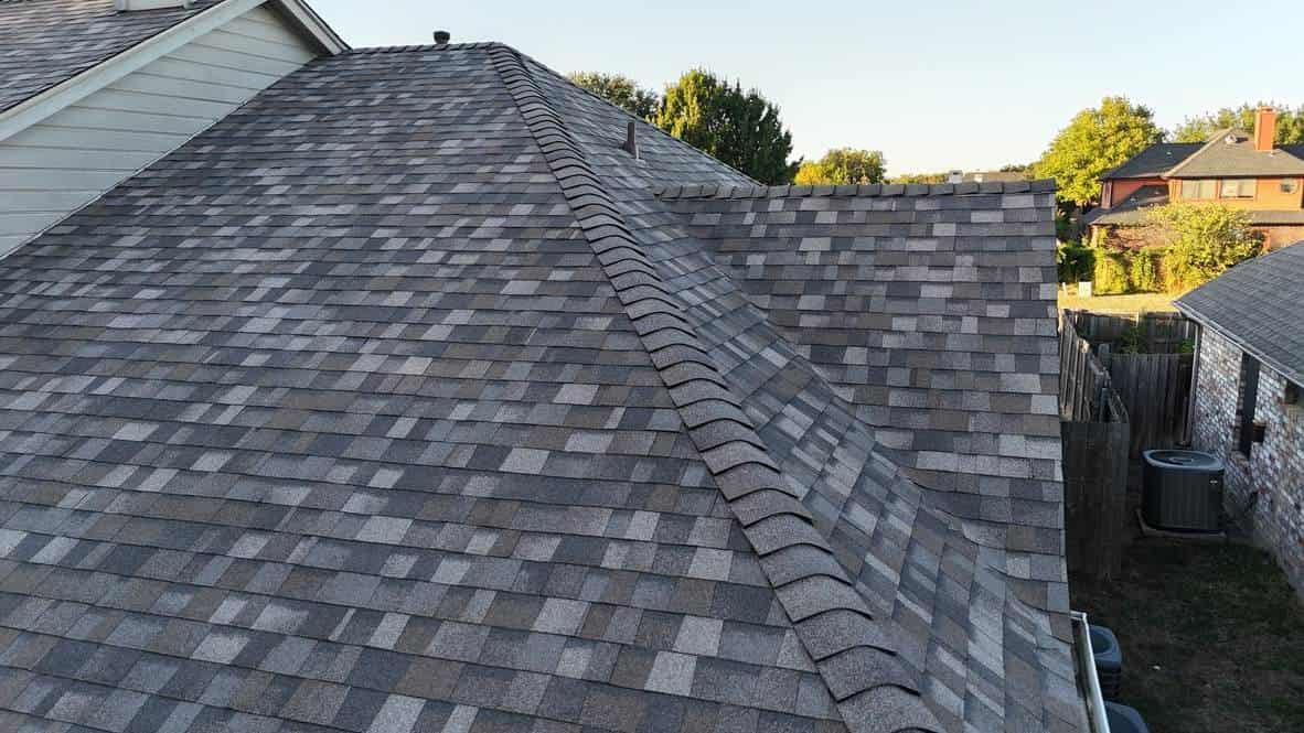 Close-up of a new shingle roof ridge and slopes