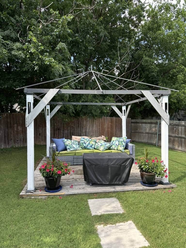 White pergola over a backyard patio seating area