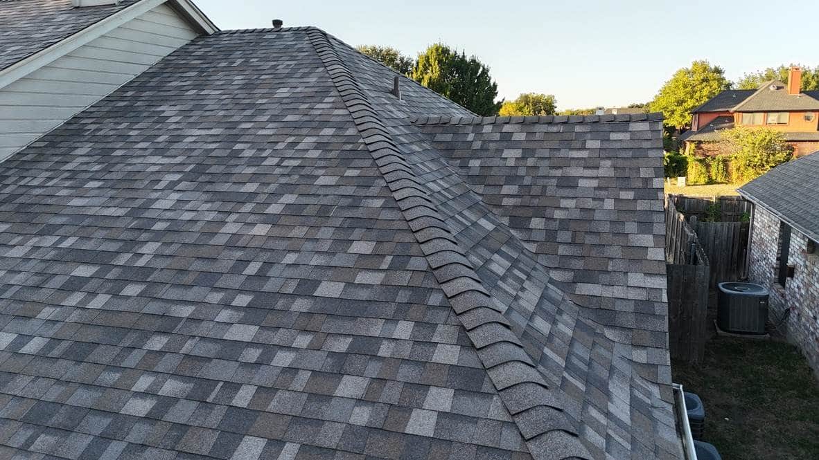Close-up of a new shingle roof ridge and slopes