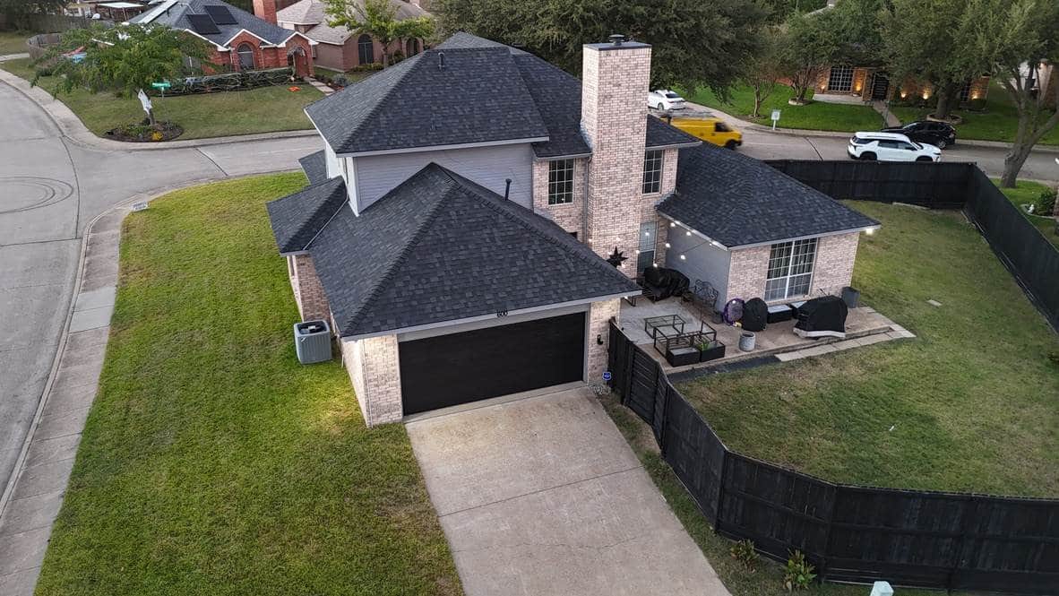 Aerial view of a home with a new charcoal shingle roof