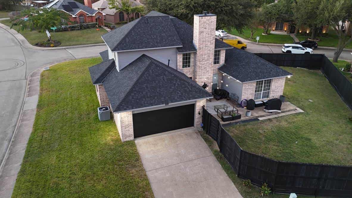 Aerial view of a home with a new charcoal shingle roof